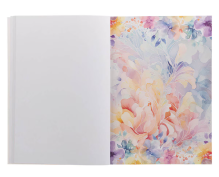 Open spread with a pink and blue watercolor page beside a blank writing page